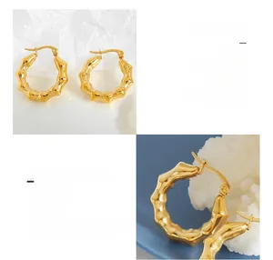 Detailed close-up of U-shaped titanium steel earrings with 18K gold plated texture