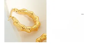 Detailed view of 18K gold plated C-shaped earrings with irregular ripple texture design
