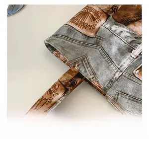 Detail of reinforced stitching and vintage denim print texture on large tote bag