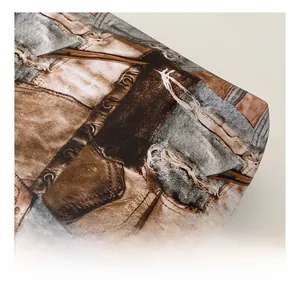 Macro detail of retro printed tote bag fabric with denim patchwork and frayed edge textures