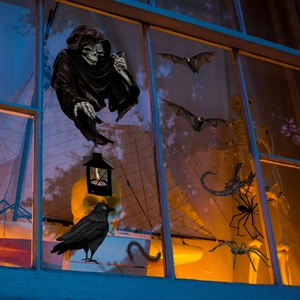 Halloween window decals featuring grim reaper, bats and spiders for spooky home decor
