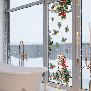 Double-sided Christmas cat window sticker with holly berries and warm festive lighting