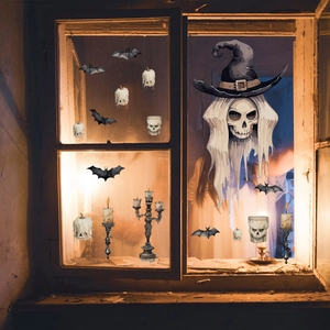Close-up of Halloween window stickers featuring skull, bat, and candle on wood frame
