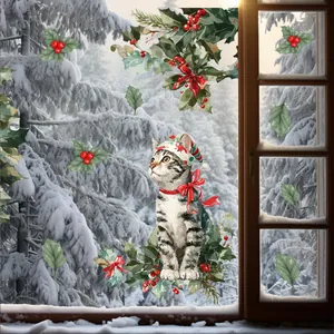 Detailed view of festive Christmas tabby cat window stickers on snowy glass backdrop