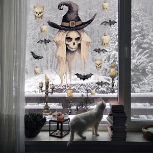Detailed Halloween window stickers showing a wizard skull, bats, and pumpkins on glass