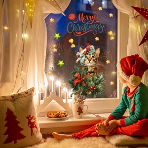 Detailed Christmas window sticker featuring a hand-painted cat with festive wreath and stars