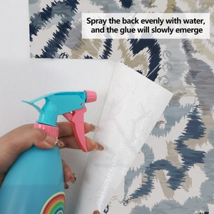 Detailed demonstration of water-activated self-adhesive wallpaper with abstract blue patterns