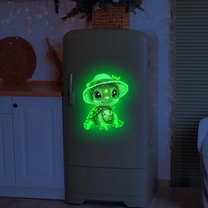 Luminous turtle wall sticker with straw hat on fridge in a cozy night kitchen setting