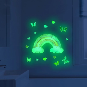 Luminous rainbow wall decals with butterflies and hearts glowing green in dark
