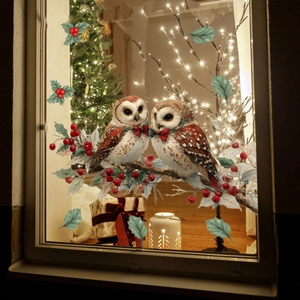 Christmas window stickers featuring owls on snowy branches with festive berries and leaves