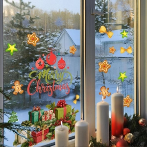 Detail of gingerbread man and Merry Christmas window stickers on a glass with snowy background