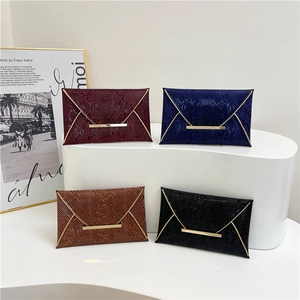 Chic envelope clutch bags in four colors with embossed faux leather and gold V-trim hardware