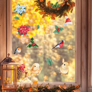 Festive Christmas window decals featuring gingerbread men, birds and poinsettia flowers