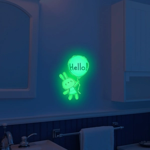 Glow in the dark wall sticker showing a green luminous rabbit and balloon with Hello text