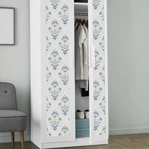 Floral decal on white double door wardrobe in a minimalist bedroom setting