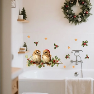 Detail showing hand-painted owl wall stickers with holly branches and festive stars decor