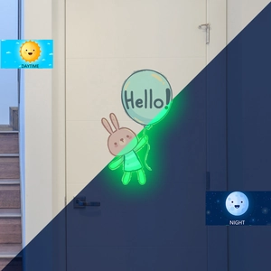 Luminous bunny wall sticker showing day and night green glow effect comparison