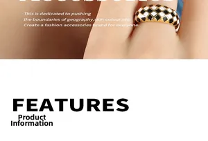 Detail view of gold-plated checkered ring with black and white enamel heart design