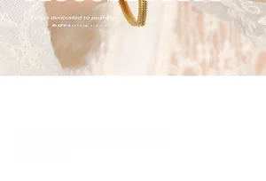 Macro shot of gold snake chain bracelet texture on white lace background with features text