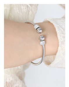 Macro shot of silver plated titanium steel bracelet with sparkling rhinestone beads