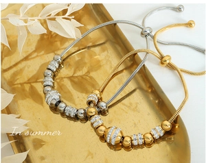 Detailed view of adjustable snake chain bracelets with gold and silver crystal beads