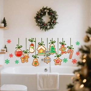 Festive gingerbread Christmas window decals featuring snowmen and trees on tile walls