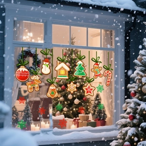 Christmas gingerbread man and tree window decals on glass with snowy house background