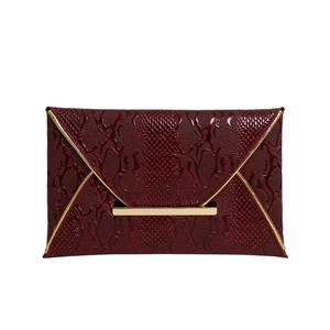 Elegant wine red snakeskin embossed envelope clutch with V-flap and gold metal accents