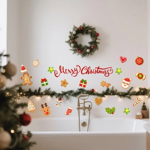Christmas window decals set with Merry Christmas text and gingerbread man on a glass wall