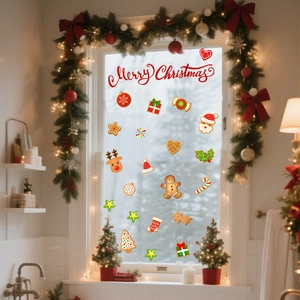 Close-up of festive gingerbread man and Merry Christmas decals on a home window glass
