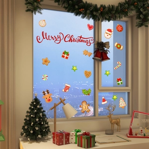 Detail of hand-painted Christmas gingerbread man stickers and festive window decorations