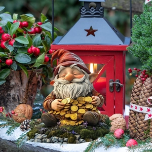 Detailed close-up of a festive Christmas gnome statue holding gold coins in a garden setting