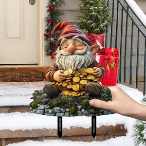 Christmas gnome sitting on gold coins garden stake outdoor decoration with ground plug