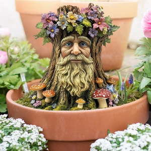 Garden tree spirit resin statue with floral crown and mushrooms in a flower pot