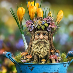 Detailed tree stump garden ornament with colorful flowers and mushroom accents in a bucket