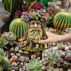 Detailed garden stake featuring a resin tree man design with flowers and mushrooms