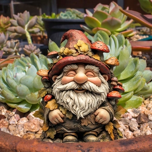 Macro detail of hand-painted garden gnome gnome figurine with red mushroom hat decoration