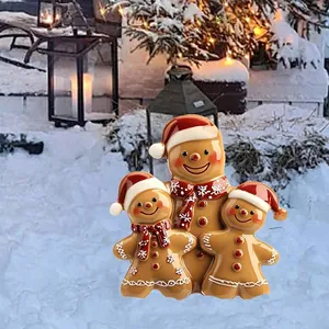 Christmas gingerbread man family yard stakes set with red hats and scarves for garden decor