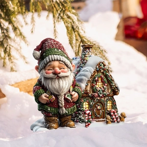 Christmas gnome and gingerbread house outdoor garden stakes set in snow scene