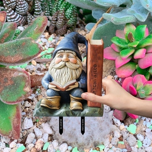 Garden gnome reading book PVC stake detail showing hand-held size and soil stakes