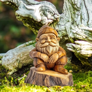 Detailed close-up of a rustic garden gnome figurine with wood-carved texture on a stump