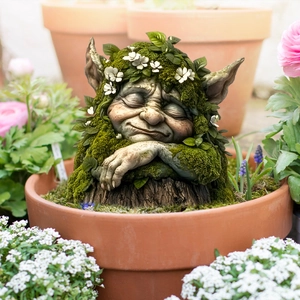 Sleeping garden gnome stake with realistic moss and floral details for outdoor potted plants