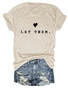 Detail of Let Them letter print on a beige crew neck t-shirt with denim shorts outfit