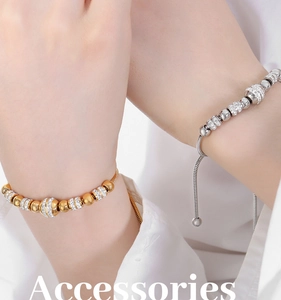 Macro detail of adjustable beaded bracelets in gold and silver with zircon accents
