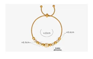 Detail of gold-plated snake chain bracelet with sparkling rhinestone beads and adjustable clasp
