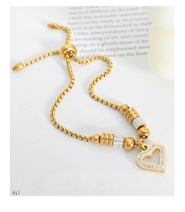 Macro detail of gold adjustable heart bracelet with pavé rhinestones and box chain