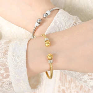 Minimalist gold and silver titanium steel open bangles with rhinestones on model