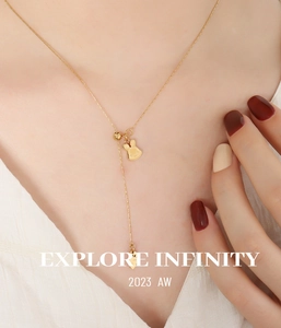 Close-up of 18K gold plated Y-necklace featuring a rabbit pendant and adjustable sliding bead