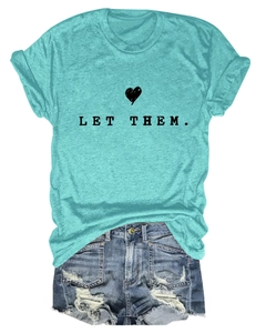 Flat lay of lake blue t-shirt with Let Them text and distressed denim shorts