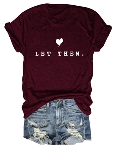 Burgundy crewneck T-shirt with LET THEM text print and distressed denim shorts flat lay